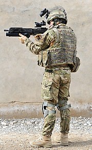 A British Army infantryman showing full combat dress and standard personal kit as of 2011, including Mk. 7 helmet and Osprey Mk. 4 vest (back)