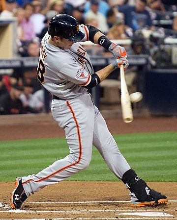 Posey hitting a pitch in 2013