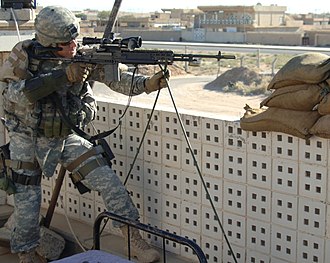 US Soldier using a M14 equipped with a Sage M14ALCS chassis stock resting on two-legged shooting sticks CSA-2006-10-17-093634.jpg