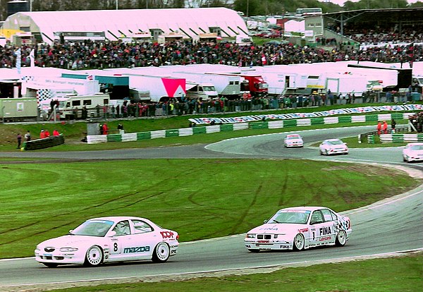 Leslie (Mazda Xedos 6) chased by Joachim Winkelhock (BMW 318i) at Brands Hatch during the 1994 BTCC season.