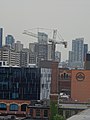 Distant construction cranes on Toronto's skyline, 2015 07 08 (14).JPG - panoramio.jpg