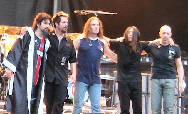 Dream Theater after a concert in Paris during the first European leg of their tour (2005). From left to right: Mike Portnoy, John Petrucci, James LaBr