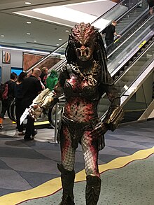Cosplayer wearing creature suit of a female Predator alien FXC17 female predator.jpg