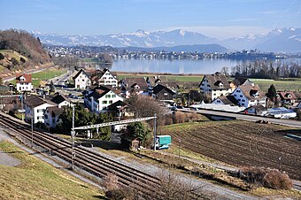 Feldbach on Zürichsee lake shore, Rapperswil and bay of Kempraten in the background