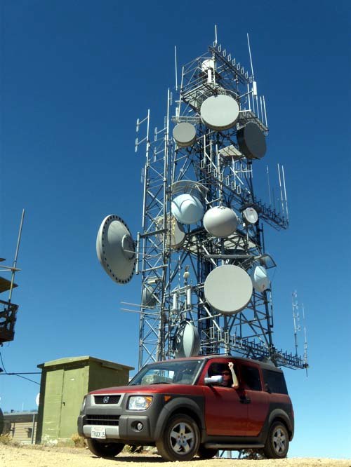 A telecommunications tower with a variety of dish antennas for microwave relay links on Frazier Peak, Ventura County, California. The apertures of the