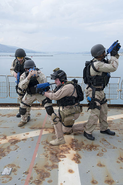 File:From left, U.S. Navy Machinery Repairman 2nd Class Robert Briggs, Electronics Technician 1st Class Timothy Ettinger, Interior Communications Electrician 2nd Class Ryan Pietras and Chief Fire Controlman Darnell 131216-N-UD469-258.jpg