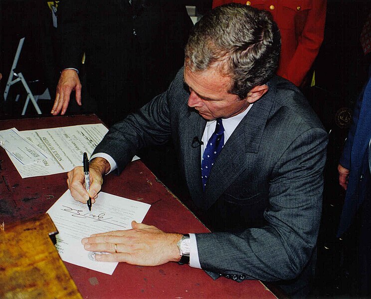 File:George W. Bush in Concord, New Hampshire signing papers for presidential run.jpg