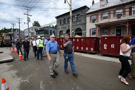 Governor of Maryland Larry Hogan tours Ellicott City, viewing damage left by the 2016 floods, accompanied by county executive Allan Kittleman.