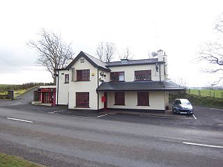 <span class="mw-page-title-main">Aughafatten</span> Village in County Antrim, Northern Ireland