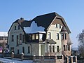 Villa with outbuildings and fencing