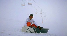 A snowboarder equipped with Head snowboard