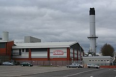 Image 26Heinz, although based in Hayes in Middlesex, has the largest food processing complex in Europe at a 55-acre (22 ha) site at Kitt Green in Wigan, which produces 1.4 billion cans of food each year; it is accessed to the east of the Orrell Interchange of the M6 (A577); the 38-acre Heinz NDC is next door (from North West England)