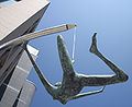 English: Jersey Girl, sculpture by Rowan Gillespie, commissioned by Harcourt Developments for Liberty Wharf development, Saint Helier, Jersey - inaugurated 2010. The sculpture is slightly larger than life size and is suspended by a cable connected to one of her toes. The sculptor was inspired by the Liberation of Jersey from WWII German Occupation.