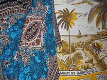 Colorful prints from Asia are popular in coastal towns. Lamba of Madagascar - comparison coastal style.JPG