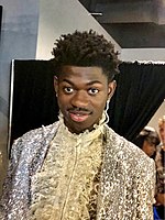 "Old Town Road" by Lil Nas X (pictured) featuring Billy Ray Cyrus spent nineteen consecutive weeks at number one on the Canadian Hot 100, breaking the record for the longest-running number-one song in the chart's history. It later ranked as the best-performing single of the year. Lil Nas X back stage at the MTV Video Music Awards 2019.jpg