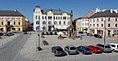 English: Přemysl Otakar square in Litovel, the Czech Republic. View from the south. There is a stand with potato sale in the middle of the square. Čeština: Náměstí Přemysla Otakara v Litovli. Pohled od jihu. Uprostřed náměstí je stánek s prodejem brambor.