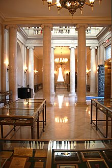 Standing in the south gallery of the entrance hall, looking north. The main doors are to the right. Looking north through Memorial Amphitheater Display Hall - Arlington National Cemetery - 2012-05-19.jpg