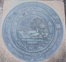 Seal of the Northwest Territory over a time capsule outside the Campus Martius Museum. The Latin phrase, "He has planted one better than the one fallen," signifies the replacement of wilderness by civilization. MELIOREM LAPSA LOCAVIT.JPG