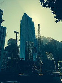 Downtown San Francisco, showing Millennium Tower (301 Mission St) center, behind it left the Salesforce Tower (under construction), far left top the 181 Fremont Street Tower (under construction), and foreground the cranes for the Park Tower (under construction) in front of the bare structure of the Transbay Terminal (under construction). From the parking lot of the Providian Financial Building / 201 Mission St, on Howard between Beale and Main. MillenniumTower-2016-06-21.jpg