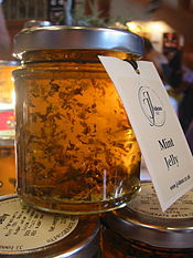 A jar of mint jelly, a traditional condiment served with lamb dishes Mintjelly.jpg