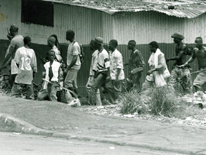 NPFL fighters search for ULIMO militants in Monrovia. National Patriotic Liberation Front fighters in Monrovia 1996.png