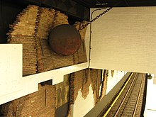 Wall decorations remembering the demolition in the Nieuwmarkt neighbourhood and protests against it Nieuwmarkt Metro Station Inside.JPG