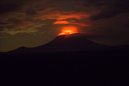 The glow from the lava lake of the Nyiragongo volcano can be seen at night.