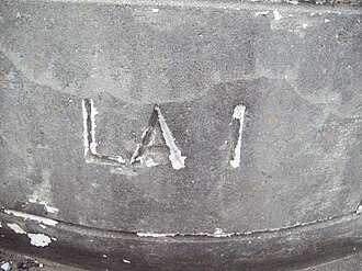 Bridge on current LA 76 stamped with LA 1 for the old alignment Old LA 1 bridge endcap.jpg