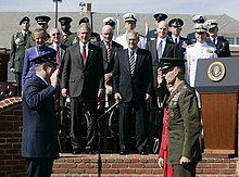 Outgoing Chairman of the Joint Chiefs of Staff, General Richard Myers swears in the incoming chairman, General Peter Pace as President George W. Bush and Secretary of Defense Donald Rumsfeld look on at the change of command ceremony at Fort Myer, Virginia on September 30, 2005. PeterPace swearing-in CJCS.jpg