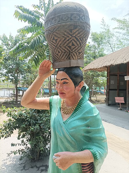 File:Phingaluk (Phingailuk or Philuk), a traditional Meitei basket used exclusively for Meitei wedding ceremonies — Classical Meitei basketry handicraft — statue of a Meitei lady wearing Innaphi & Phanek clothes and holding the basket 01.jpg