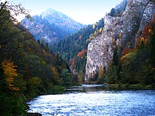 River gorge, surrounded by tree-covered mountains