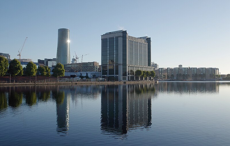 File:Reflections of Baltimore Tower in the still waters of Millwall Dock.jpg