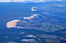 Suderoogsand, Norderoogsand, Japsand (uninhabited shoals or sand bars, left and center), and Amrum (top), with Pellworm and Fohr (green areas) at the right Suderoogsand, Norderoogsand, Japsand, and Amrum.jpg