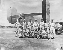 Homeward-bound B-24 Liberator of 5th Air Force's 380th Bomb Group (1945) SC 335390 - Piloting the homeward-bound B-24 Liberator of 5th Air Force's 380th Bomb Group, is Col. Forrest L. Brissey, back row, 4th from left, 5035 Trask St., Oakland, Calif. (52134340553).jpg