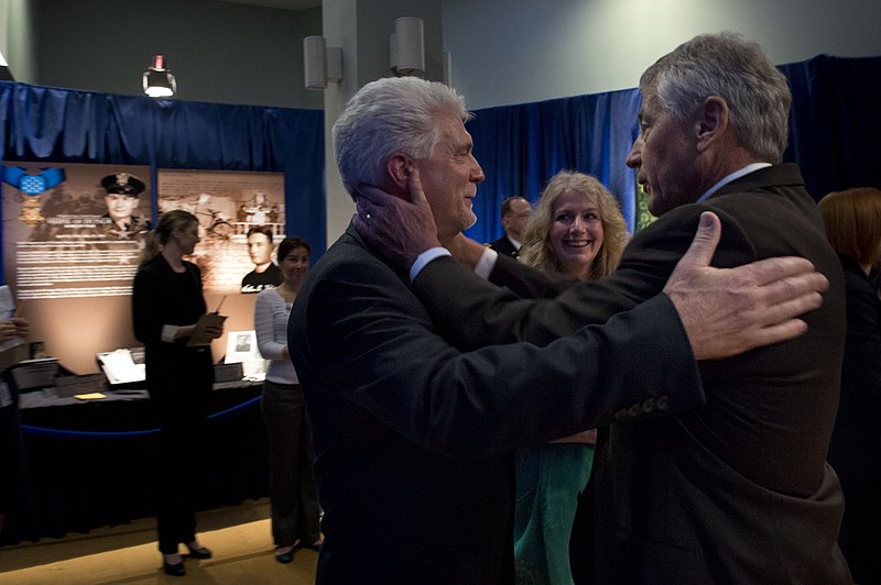File:Secretary of Defense Chuck Hagel hugs Ray Kapaun after a ceremony to induct Medal of Honor recipient Army Chaplain (Capt.) Emil Kapaun in to the Hall of Heros, April 12, 2013, at the Pentagon.jpg
