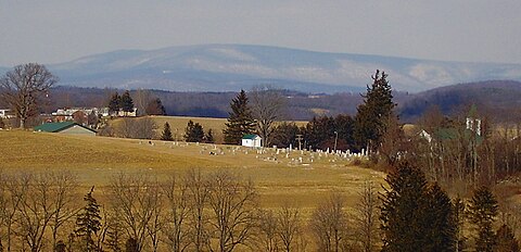 Snow covered Blue Knob Mountain (3,146 ft.) looming above the countryside