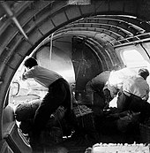 Certain air force personnel carry relief supplies onto a plane after the typhoon TY WP5606 aids from the air force.jpg