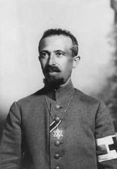 Military Field Rabbi Dr. Aaron Tänzer during World War I, with the ribbon of the Iron Cross.[59] The brassard of the red cross shows him as noncombatant. He wears the star of david as insignium