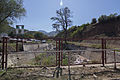 Stream next to main entrance with tailing dump in background