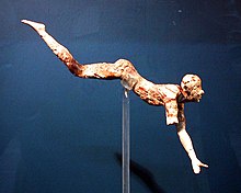 Ivory figurine of a man in a diving position