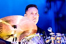 Original drummer Jimmy Chamberlin was fired in 1996 and has been in and out of the band several times since. The Smashing Pumpkins - 2019158212836 2019-06-07 Rock am Ring - 1272 - B70I8572.jpg