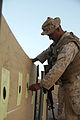 U.S. Marine Corps Maj. Yohannes Negga, with Headquarters Company, Regimental Combat Team (RCT) 3, checks his target during live-fire training at Camp Dwyer, Helmand province, Afghanistan, Aug. 21, 2009 090821-M-BO337-005.jpg