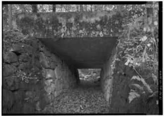 Underpass for cattle created in 1914 construction of what is now Historic Columbia River Highway VIEW THROUGH CATTLEPASS NEAR BRIDAL VEIL FALLS. - Historic Columbia River Highway, Troutdale, Multnomah County, OR HAER ORE,26-TROUT.V,1-31.tif