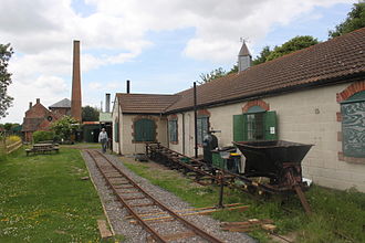 The light railway, inclined plane and exhibition hall, with the pump house and chimney in the distance. Westonzoyland Pumping Station Museum 28.JPG