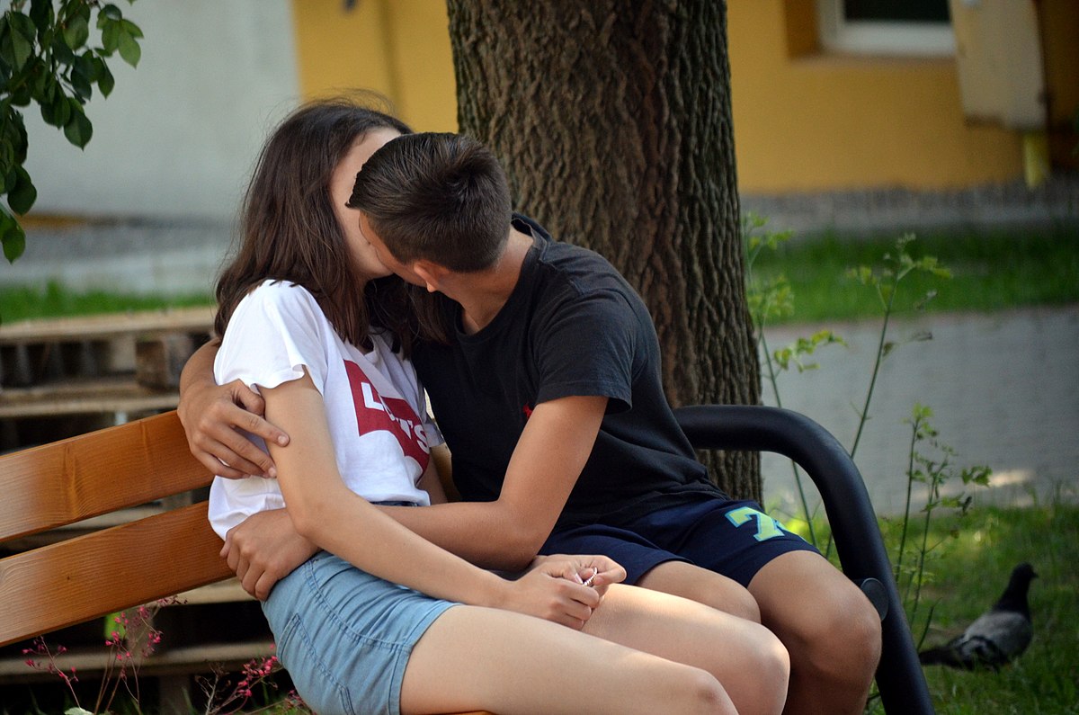Teens kissing