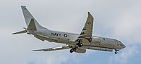 A Boeing P-8 Poseidon, tail number 168996, on final approach at Kadena Air Base in Okinawa, Japan. It has an AN/APS-154 Advanced Airborne Sensor (AAS) mounted underneath it.