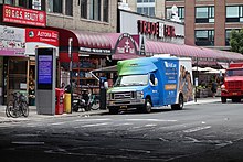 A WellCare bus in Astoria, Queens, New York City. 30th Av 31st St td (2019-08-21) 04.jpg
