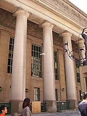 The facade of the Front Street entrance includes 22 colonnaded loggia constructed with limestone. A seagull visiting Union Station.jpg