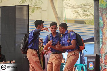 3 students performing at cultural event