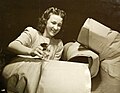 Balloon room worker makes sleeves for aircraft life rafts, 1941 (40691296580).jpg